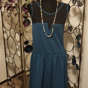Teal mini dress with sheer paneling